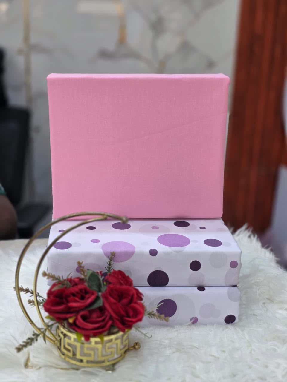 White bedsheet with purple dots